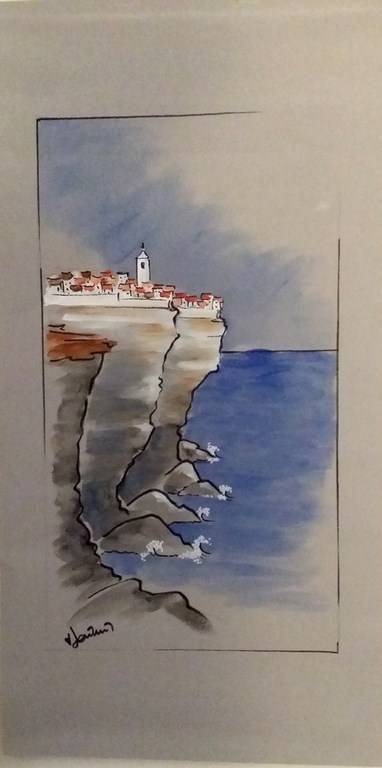 tableau sur papier peint uni village sur falaise